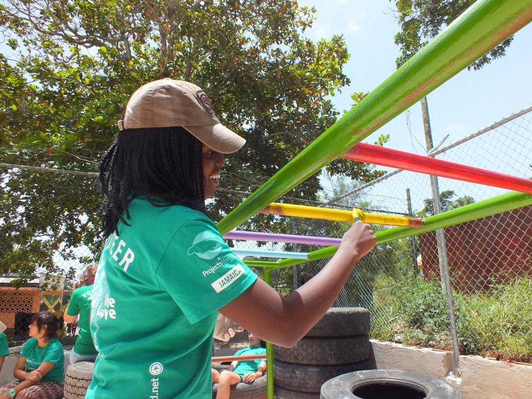 Volunteers put the finishing touches to a playground in Jamaica Volunteers put the finishing touches to a playground in Jamaica on a high school volunteer program.